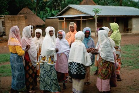 Women gather outside the mosque in Masethele, Bombali District, Sierra Leone.