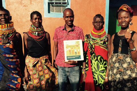 The women elected as Community Land Mobilizers in Turkana, Kenya standing with Kenya Land Alliance facilitator (center) and the Namati facilitators.